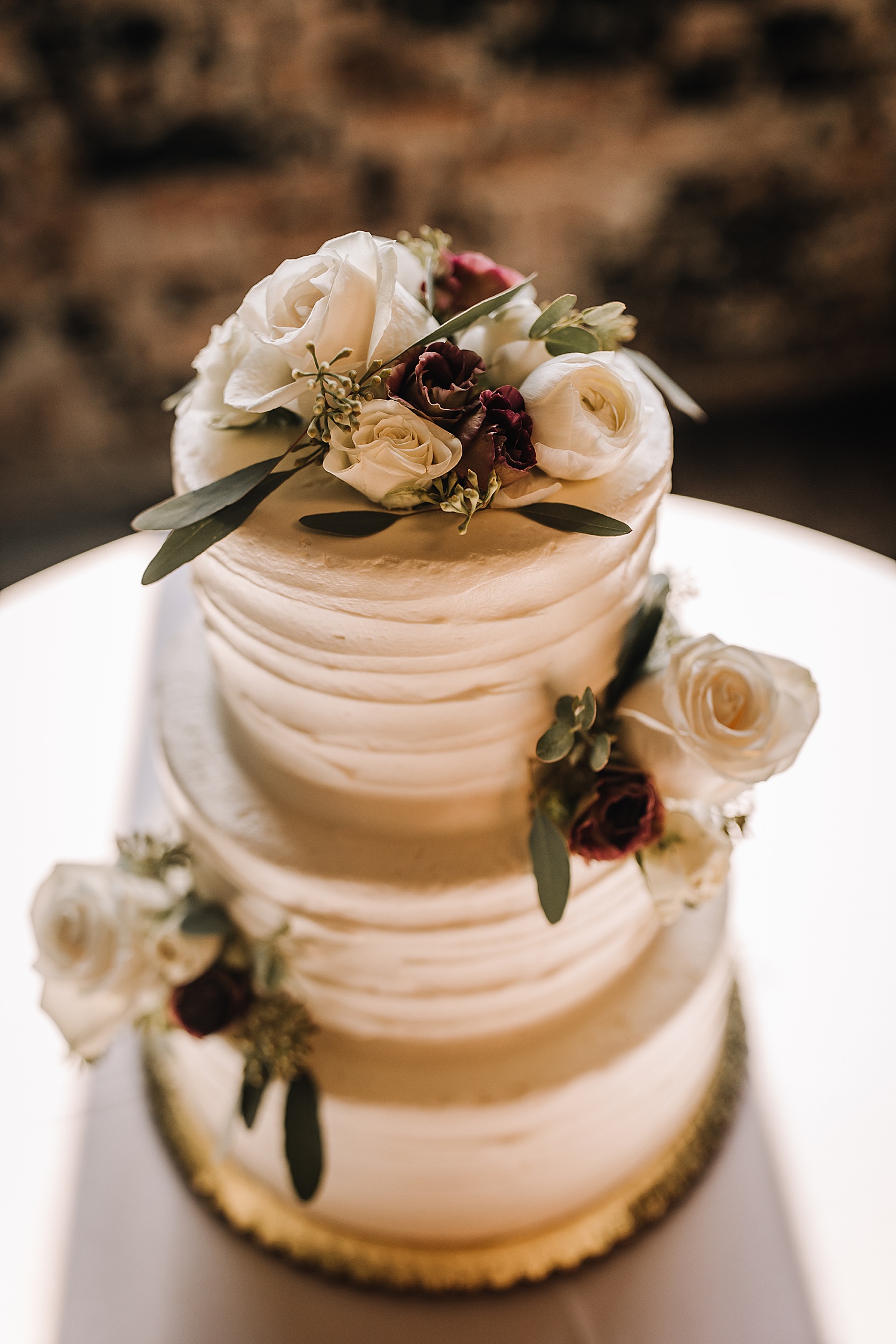 3 layer wedding cake with fresh florals at ford piquette plan in Michigan 